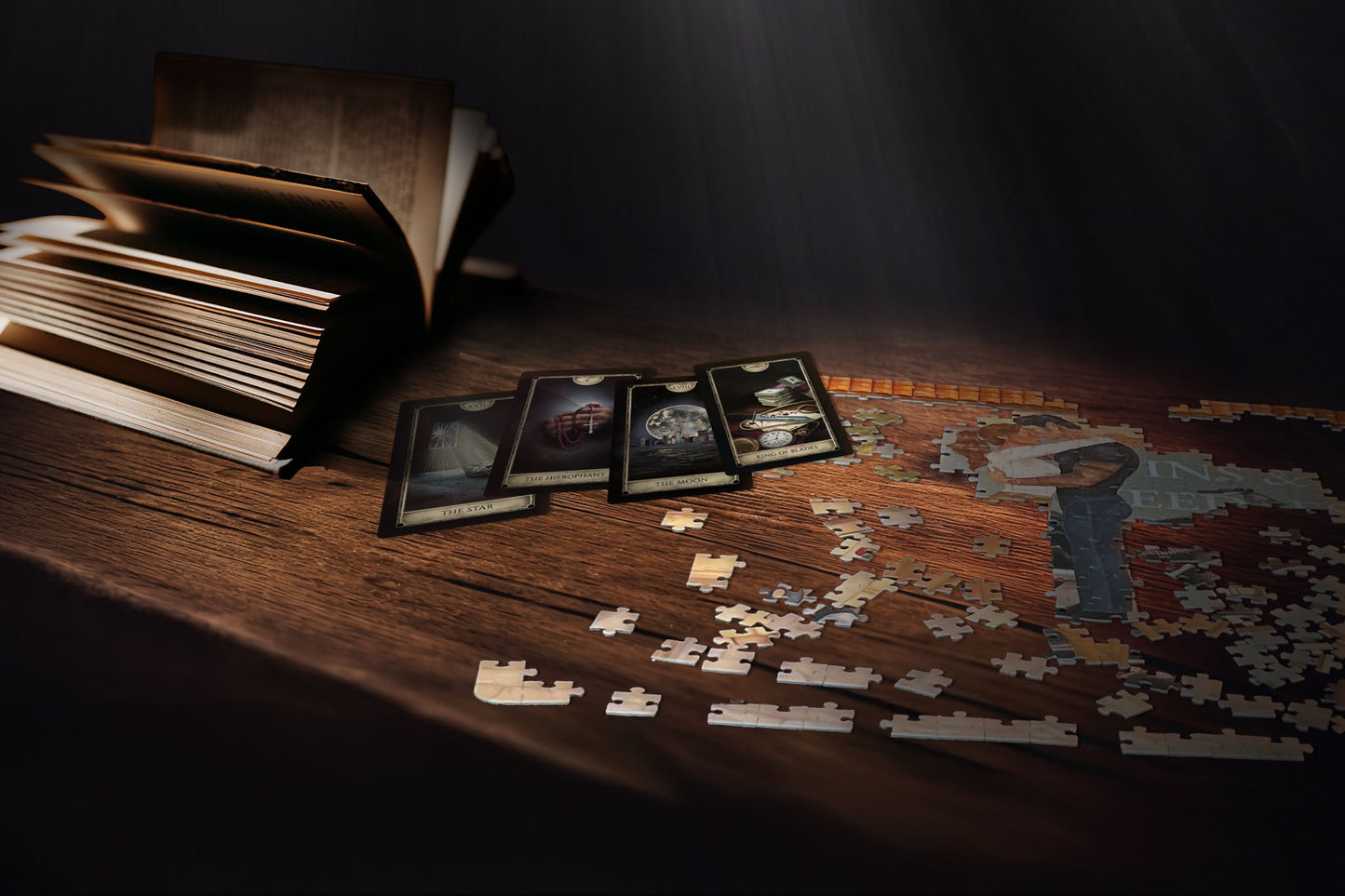 Jigsaw puzzle with completed pieces and cards on a wooden table